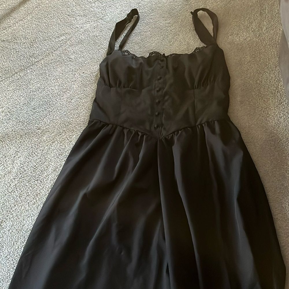 Size large long black polyester/Lastine Buser address straps tie in back